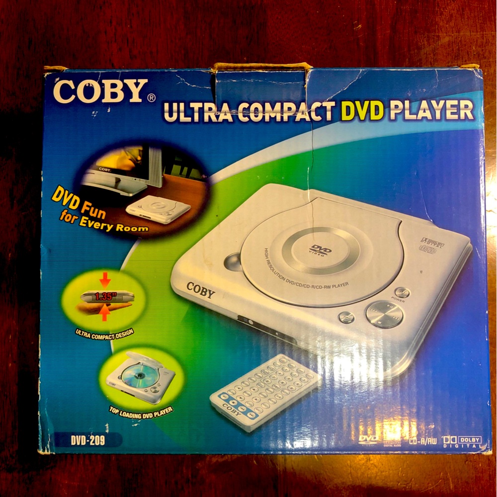 Coby DVD Player Ultra Compact DVD 209 Top Loading With Remote Control - Av Cable